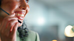 Happy woman, night and consultant with mic in office for telecommunication or online advice. Female person, consultant or working late with smile for virtual assistance on space in call center agency