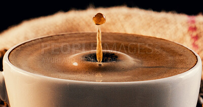Buy stock photo Closeup, coffee and drop in cafe with ripple, warm drink and caffeine in latte for morning beverage. Mug, liquid splash and cappuccino in restaurant with froth, strong espresso and delicious brew.