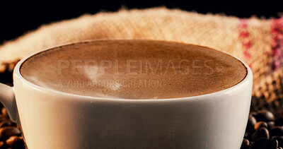 Buy stock photo Closeup, coffee and beans in cafe with froth, warm drink and caffeine in latte for morning beverage. Mug, brown liquid and cappuccino in restaurant with foam, strong espresso and delicious brew.