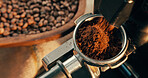 Coffee, machine and portafilter in cafe with grinder, beans or latte preparation for dark roast drink. Beverage, equipment and powder in holder with ground ingredients, espresso or cappuccino process