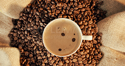 Buy stock photo Above, beans and coffee cup in cafe with foam, warm drink and caffeine in latte for morning beverage. Mug, brown liquid or cappuccino in restaurant with froth, espresso ingredients or delicious brew.