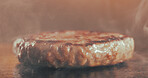 Grill, burger and patty in restaurant with smoke, cuisine preparation or cooking meat for fast food. Heat, raw beef and protein in kitchen with steam, catering service and hospitality for lunch meal.
