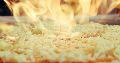 Buy stock photo Oven, pizza and baking in restaurant with fire, cheese melting and Italian cuisine for catering service. Flame, meal or flatbread cooking in diner for food preparation, takeaway lunch or hospitality.
