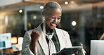 Happy, black woman and winning with tablet at night for promotion or business success in office. Excited, female person or working late with smile or technology for bonus or good news in workplace