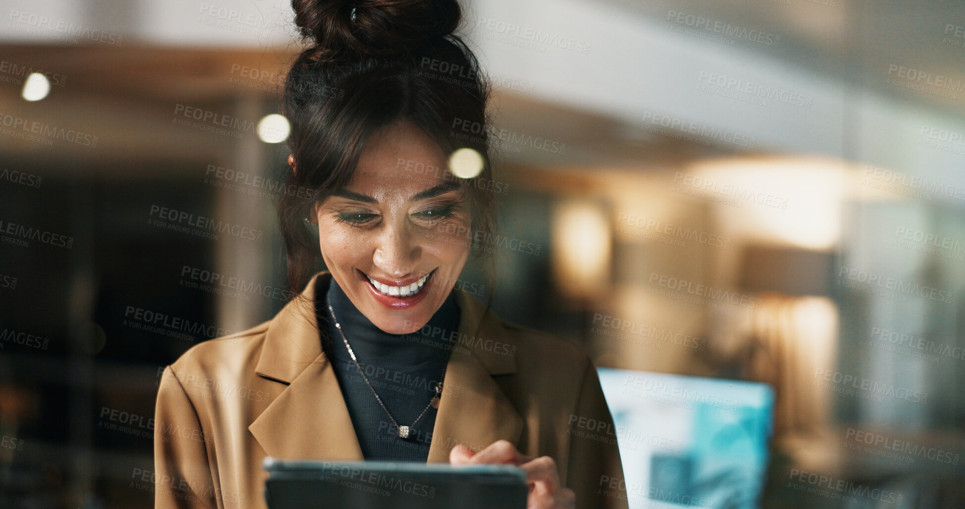 Buy stock photo Woman, tablet and smile at window in office for review, night and feedback at startup company. Person, happy and editor with solution by glass with tech, proposal and application at media agency
