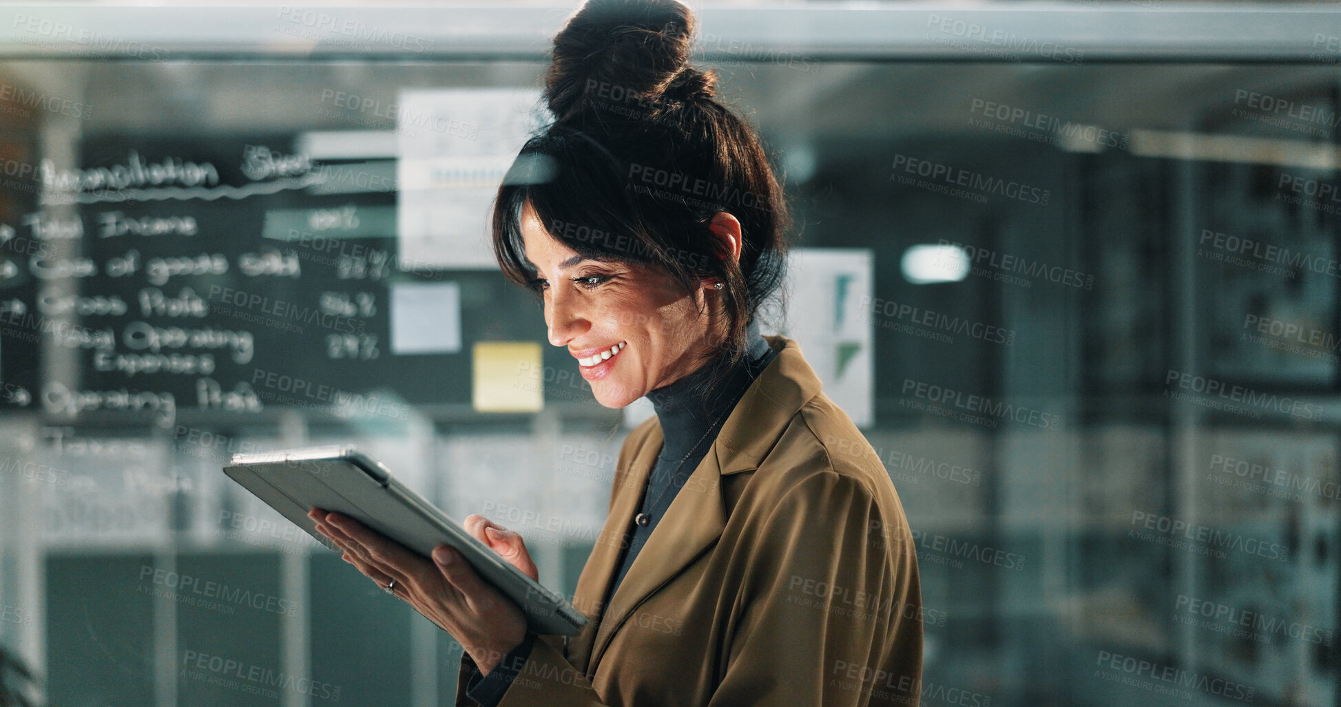 Buy stock photo Happy woman, planning and night with tablet in office for business project, tasks or agenda. Female person, analyst or working late with smile on technology for corporate imporvement or development