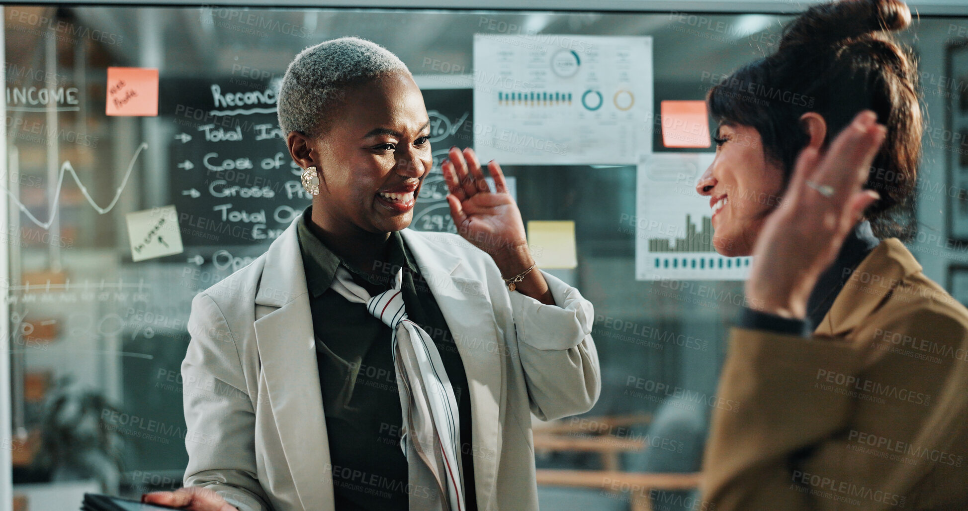 Buy stock photo Happy women, night and teamwork with high five in office for business success or profit. Excited, female people or colleagues working late with smile for company improvement or good job in workplace