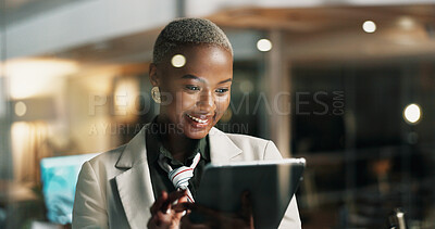 Buy stock photo Night, reading or woman with tablet by window, publishing deadline or review story for digital site. Bokeh, tech or African journalist with grammar check app, late article editing or smile in office