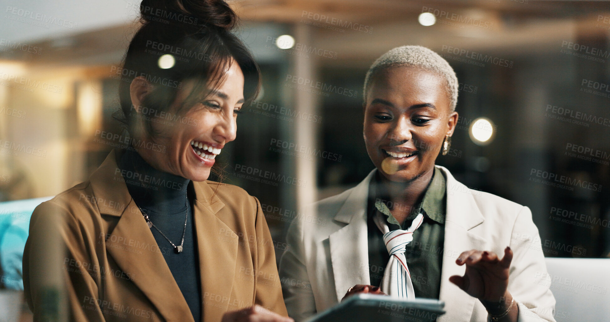 Buy stock photo Women, tablet and team at window in office at night, happy or funny chat at finance company. Business people, tech and app at glass wall, feedback report or laugh with asset management at agency