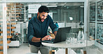 Business, man and reading with laptop at night for research, data analysis and finance report. Smile, person or pc with financial statistics, investment information and working late for profit growth
