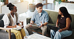 Design, tablet and talking with business people on sofa in office for collaboration or discussion. Conversation, planning and teamwork with designer group in creative workplace for meeting or review