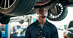 Black man, mechanic and inspection with car in workshop for automotive repair, fix or diagnostics. Male person, engineer and checking vehicle for road worthy, calibration or motor service in garage