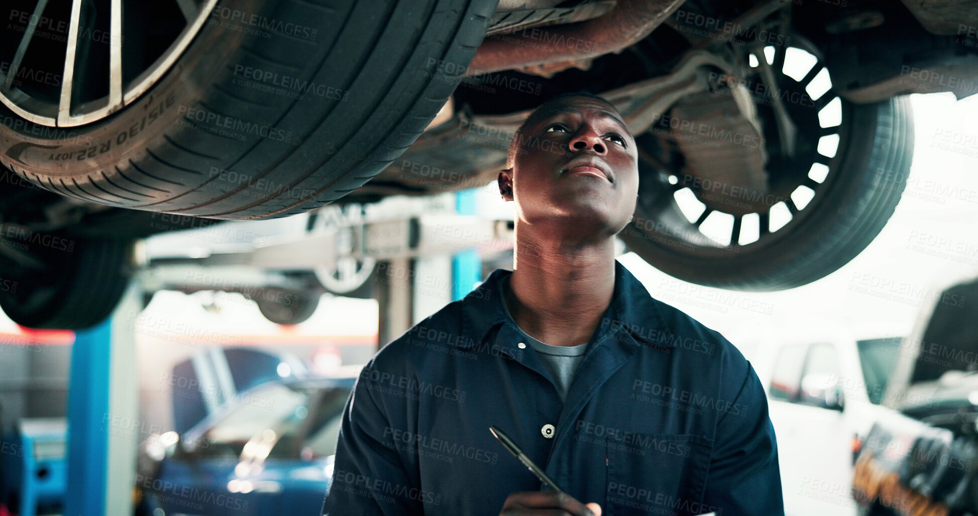 Buy stock photo Black man, mechanic and inspection with car in workshop for automotive repair, fix or diagnostics. Male person, engineer and checking vehicle for road worthy, calibration or motor service in garage
