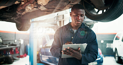 Buy stock photo Mechanic, inspection and black man with checklist in car repair shop for diagnostic system, transport or calibration. Engineering, maintenance or technician with person in garage for service report