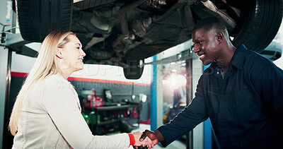 Buy stock photo Happy people, customer or handshake with mechanic for fix, automotive service or repair in garage. Man, woman or engineer shaking hands with smile for mechanical diagnostic or thank you in workshop