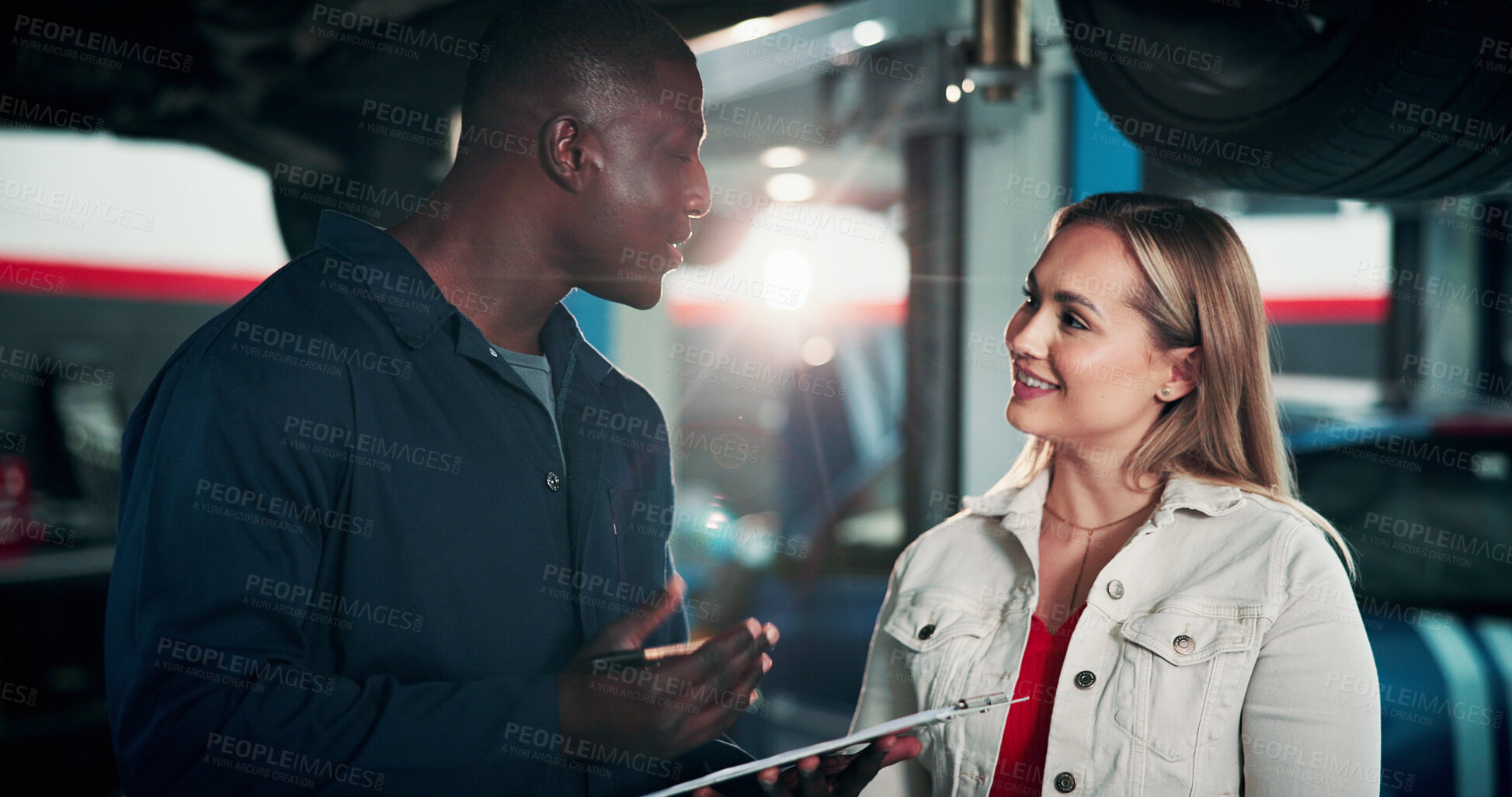Buy stock photo Happy, customer and man with clipboard in garage, discussion and consultation for damage assessment. Repair shop, mechanic and woman with smile for car service, flare or quote for vehicle maintenance