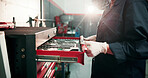 Person, mechanic and hands with tool tray in garage for automotive service, repair or fix. Engineer, technician or checking equipment cart for vehicle assessment, diagnostic or inspection in workshop