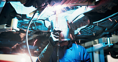 Buy stock photo Mechanic, welding and person in workshop by car for diagnostics, maintenance or auto service. Garage, sparks and technician with equipment for vehicle inspection, fixing or engine repair with helmet