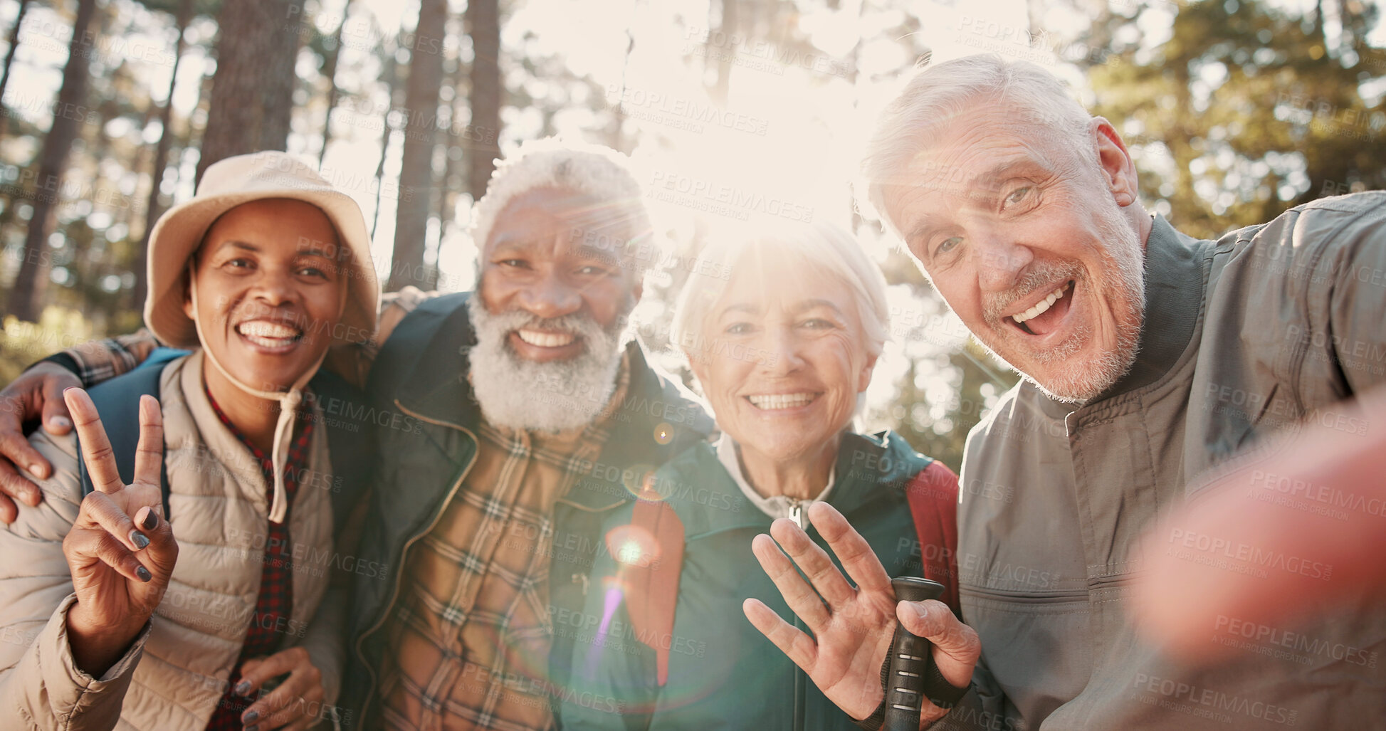 Buy stock photo Portrait, selfie and old people with smile for hike, bonding and memory with friends on social media. Hiker, flare and senior group with peace sign, profile picture and diversity on adventure trip