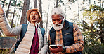 Hiking, old couple and lost with smartphone in woods, talking and searching for location on website. Outdoor, senior hiker and black people with digital map on holiday, low angle and travel together