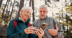 Hiking, old couple and happy with smartphone for map, talk and search for travel destination on web. Outdoor, backpacker and elderly people with mobile for direction, low angle and adventure in woods