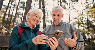 Buy stock photo Hiking, old couple and happy with smartphone for map, talk and search for travel destination on web. Outdoor, backpacker and elderly people with mobile for direction, low angle and adventure in woods
