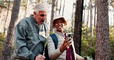 Buy stock photo Nature, hiking and selfie with people and silly for adventure with retirement, wellness and health. Travel, picture and mature interracial couple with digital tech for social media, memory and post