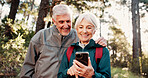Hiking, old couple and scroll with smartphone in forest, laughing and search for travel destination. Outdoor, backpacker and elderly people with mobile for direction, adventure and happy together