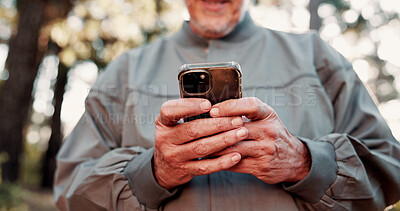 Buy stock photo Hiking, phone and hands of old man in forest for wellness, fresh air and online for direction. Travel, morning and elderly person on nature trail for adventure, health and exercise on smartphone