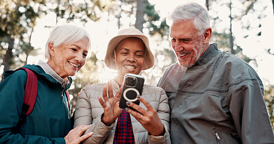 Buy stock photo Hiking, happy and senior people with phone for wellness, fresh air and online app for navigation. Travel, morning and elderly friends on smartphone for direction, trekking or exercise on nature trail
