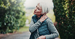 Outdoor, fitness and senior woman with neck pain on break, hurt or joint tension with workout injury. Park, exercise and old person with inflammation after training accident, space and muscle strain