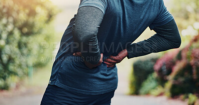 Buy stock photo Workout, injury and hands with back pain at park, fatigue or joint tension with pressure in morning. Outdoor, exercise and old person with muscle strain after training accident, space and bad posture