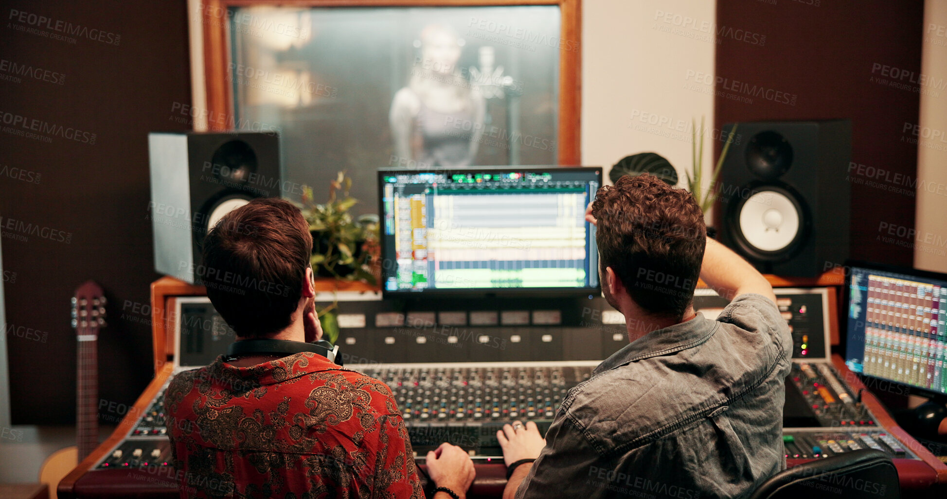 Buy stock photo Back, music and sound with people talking in studio together for audio engineering or production. Computer screen, recording and synthesizer with DJ team in control room for balance or mixing