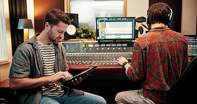 Buy stock photo Sound engineer, tablet and man in recording studio for music, composition or song quality with team. Collaboration, mixing audio or editing with tech for equalizer, creative production and mastering