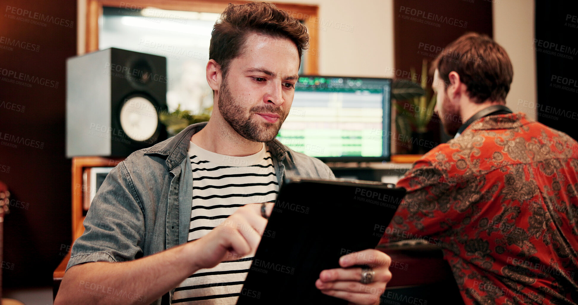 Buy stock photo Tablet, man and sound technician in recording studio, digital editing software and music production. Mixing app, tech or people with audio effects for acoustic resonance, amplify song or control room