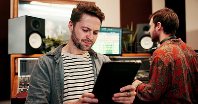 Buy stock photo Tablet, man and sound engineer in recording studio, digital editing software and music production. Mixing app, tech and people with audio effects for acoustic resonance, amplify song and control room