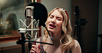 Microphone, woman and singing in recording studio for music, audio production and song with talent. Musician, artist and person with vocals for sound, album and voice with creative performance