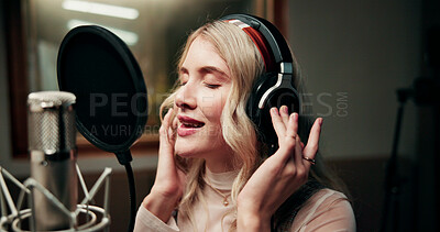 Buy stock photo Singer, microphone and person in studio with headphones, production or musician in performance. Talent, music recording or artist in booth with tech, song or sound entertainment for creative album.