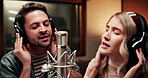 Sing, microphone and people with headphones in recording studio, vocal capture and song rehearsal. Tech, music artist and couple with performance for album feature, teamwork and talent for production