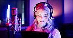 Woman, neon and broadcaster with mic on tablet for radio podcast or recording in production studio. Female person, announcer or journalist working late with technology or headphones for news on air