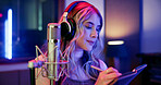 Woman, musician and writing notes in studio for songwriting, editing lyrics and recording audio. Portrait, female artist and headphones with mic for music production, composing song and rehearsal
