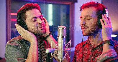 Buy stock photo Artist, people and singing in recording studio with headphones, song performance and music production. Creative duo, men and singer at record label with microphone, talent or collaboration for album.