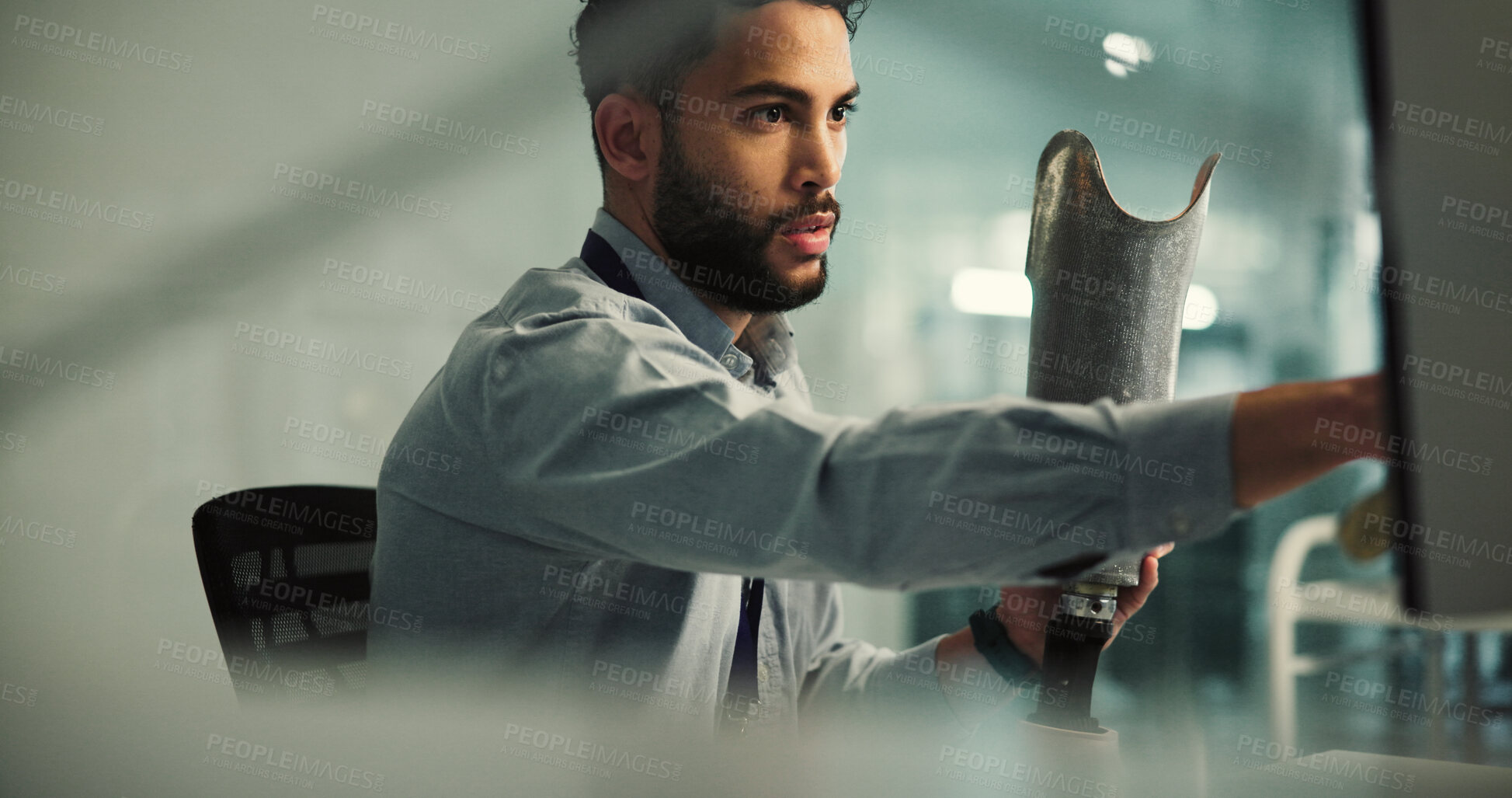 Buy stock photo Prosthetics, leg or man with computer in office, prototyping process or model review for development. Pc, mobility test or engineer with artificial limb for research, bionics project or medical tech
