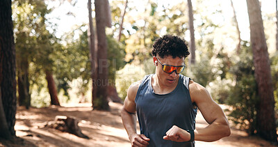 Buy stock photo Fitness, smart watch and runner with man in forest for workout stats, distance tracking and health. Exercise performance, wellness and tech with person outdoor for speed monitor and stopwatch
