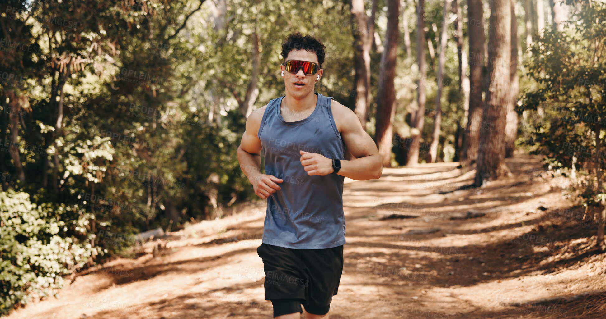 Buy stock photo Fitness, running and man in forest, wellness and challenge for health benefits, nature and energy. Runner, athlete and person in woods, cardio workout or exercise with endurance or training in Canada