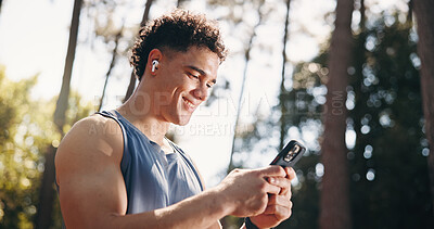 Buy stock photo Exercise, happy and man in nature with phone for social media after training, fitness and workout. Sports, athlete and person typing on smartphone for health app, internet and online chat outdoor