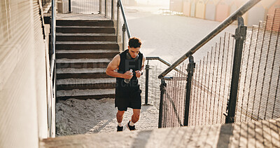Buy stock photo Running, fitness and man on stairs for exercise, workout and training for cardio, health and wellness. Athlete, sports and person outdoor with active hobby for steps, endurance and runner challenge