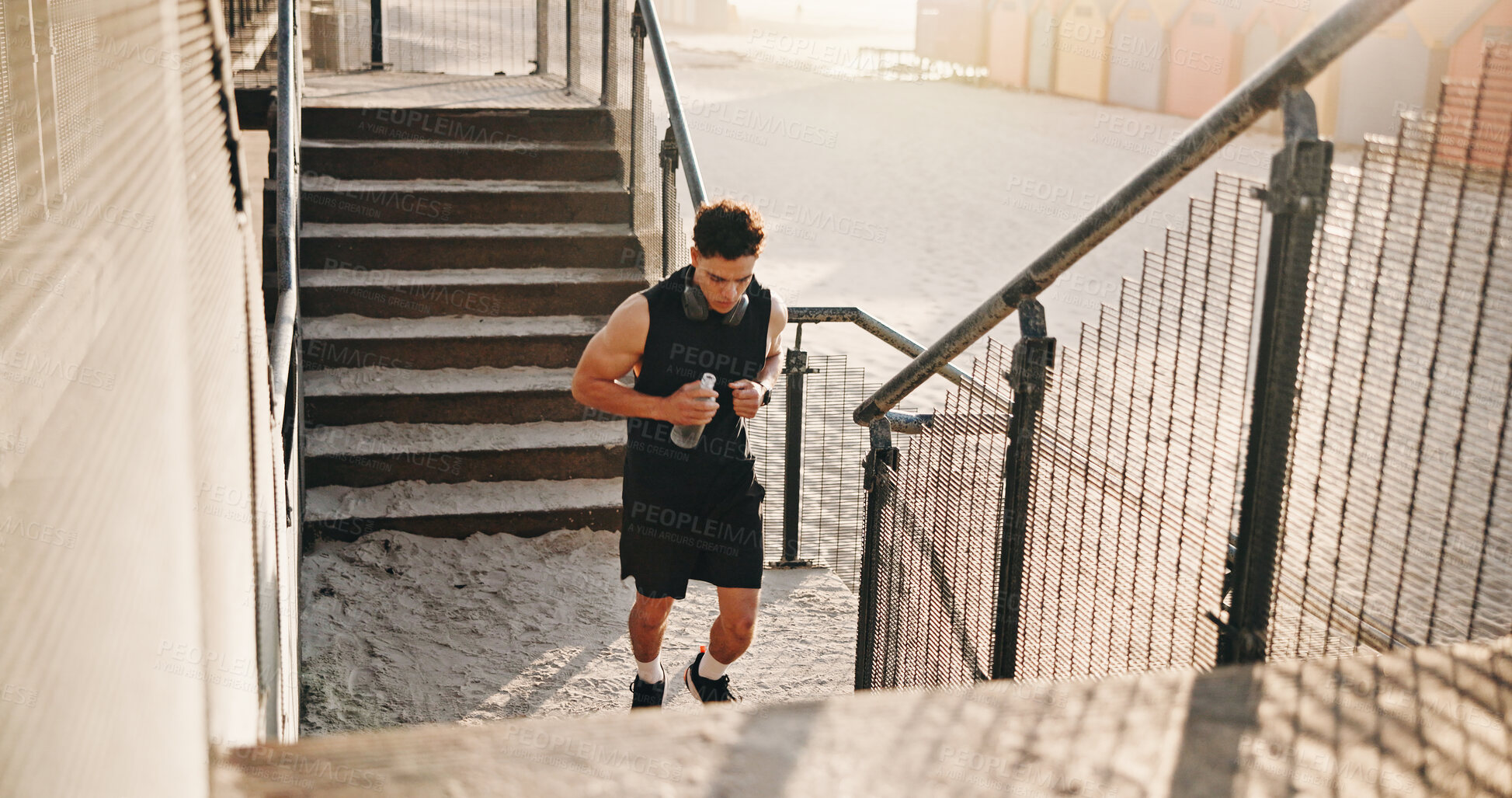 Buy stock photo Running, fitness and man on stairs for exercise, workout and training for cardio, health and wellness. Athlete, sports and person outdoor with active hobby for steps, endurance and runner challenge