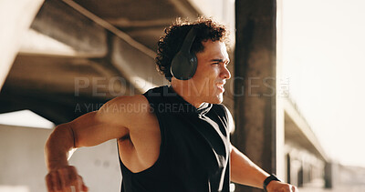 Buy stock photo Thinking, athlete and man with headphones, bridge and listening to fitness podcast on workout break. Outdoor, runner and person with tech for audio, streaming and exercise reflection for wellness