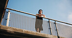 Athlete, thinking and man with headphones on bridge, wonder or memory of workout with music playlist. Outdoor, low angle and person with tech for audio, space and reflection after exercise and health